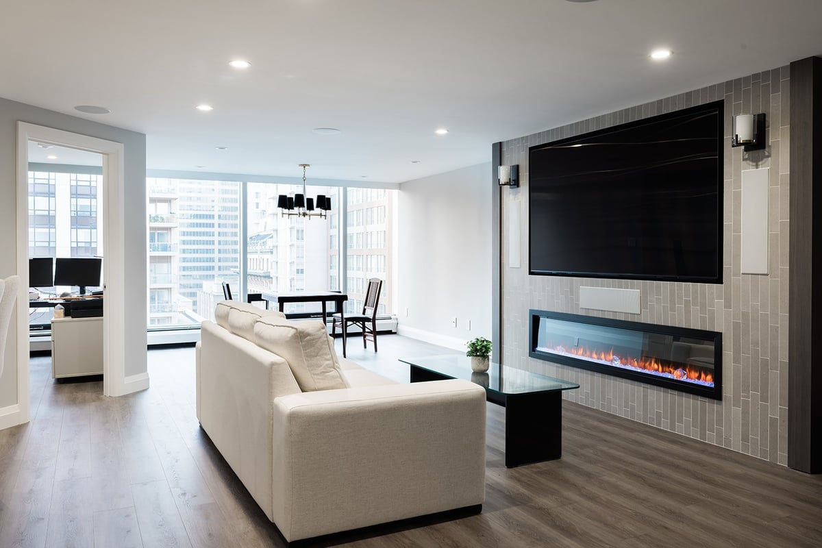 Luxury downtown Toronto condo renovation open-concept living room space with fireplace by Golden Bee Condos