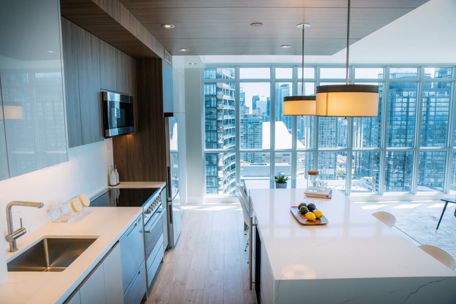 Downtown Toronto condo renovation kitchen with island and pendant lighting