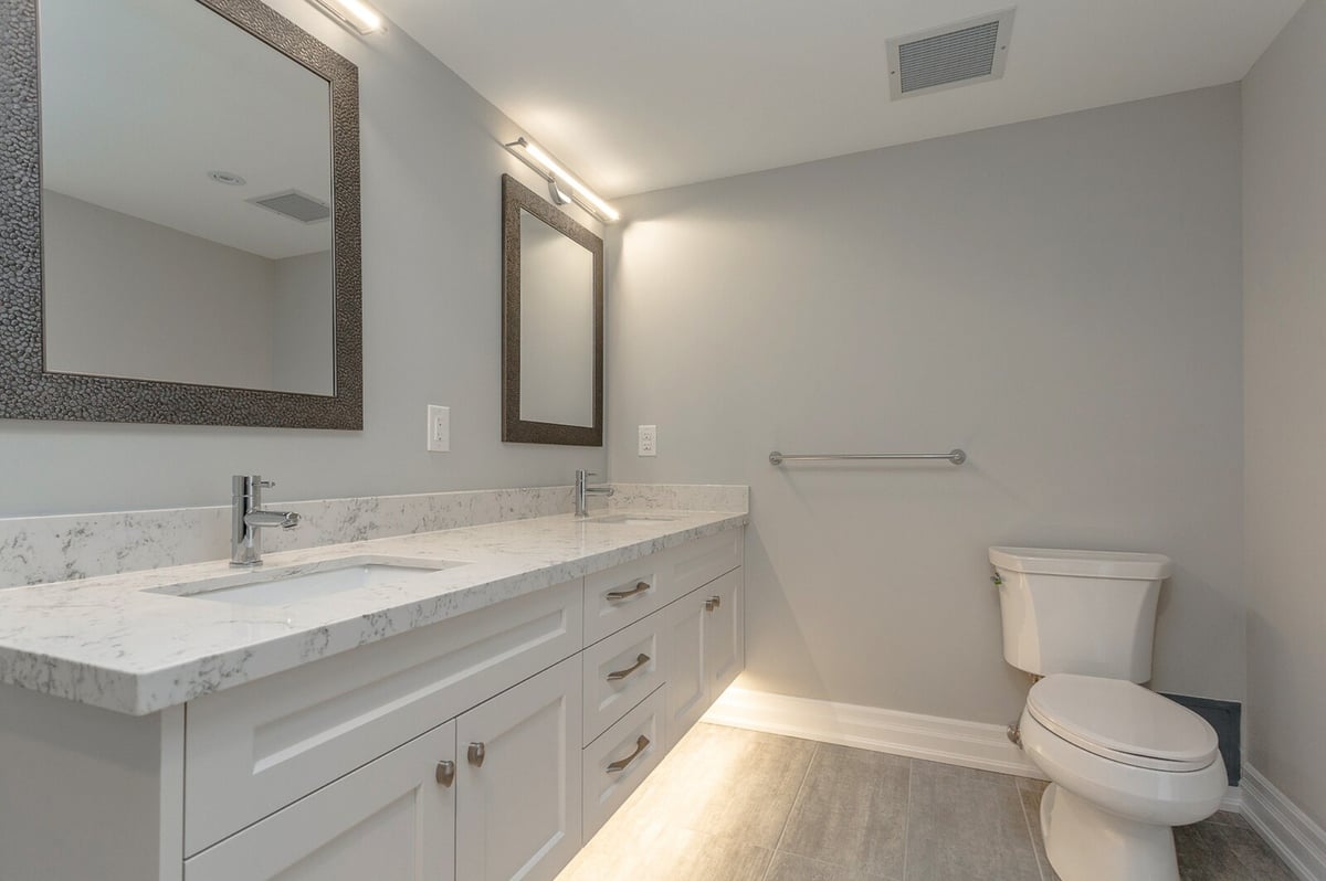 His and her vanity under lit in bathroom renovation condo in Toronto