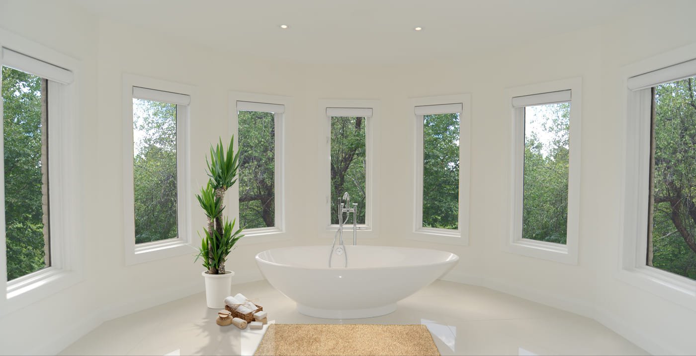 Luxury condo bathroom in Toronto with curved walls and window panels