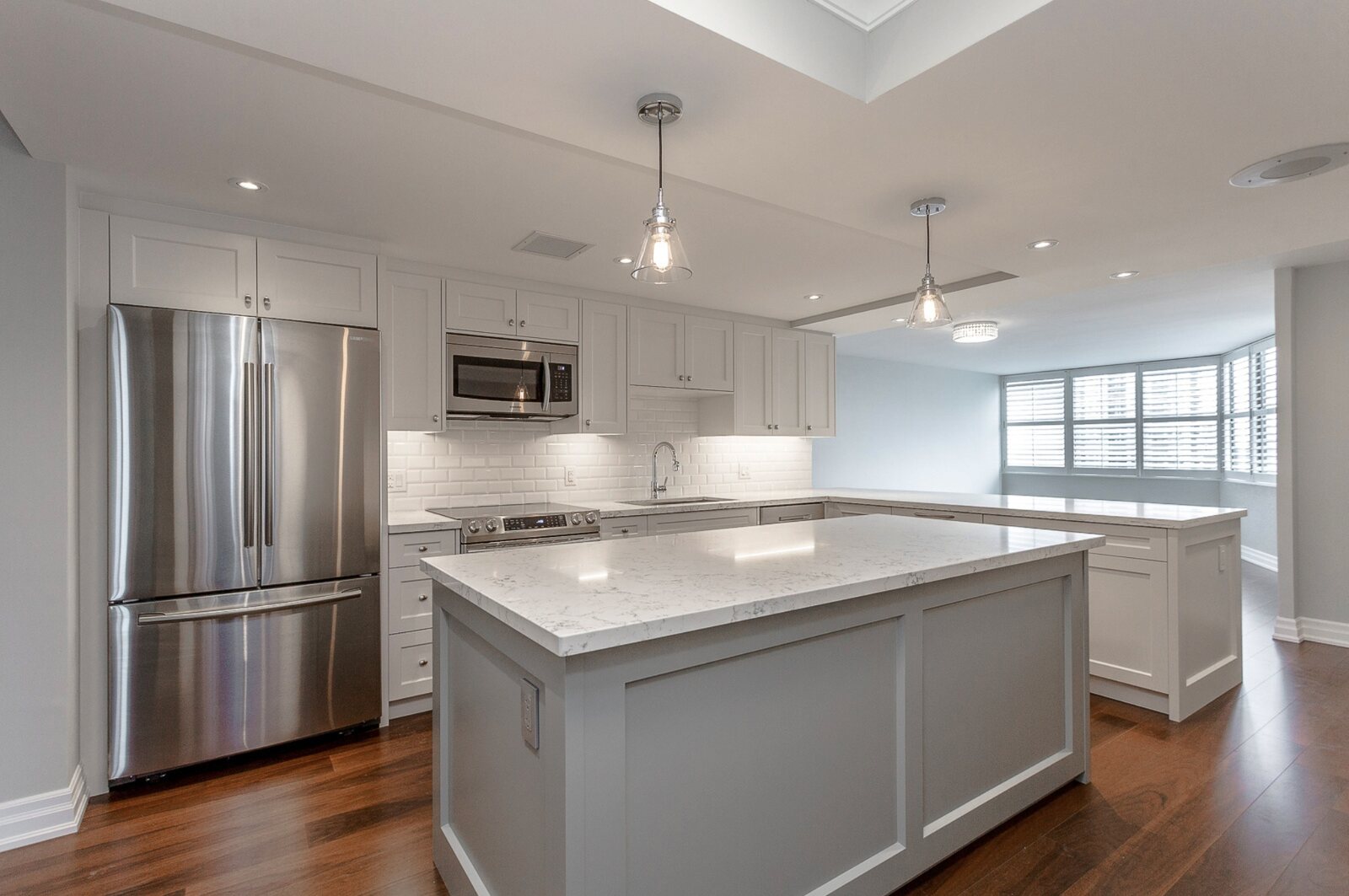 white cabinets in kitchen condo renovation in toronto